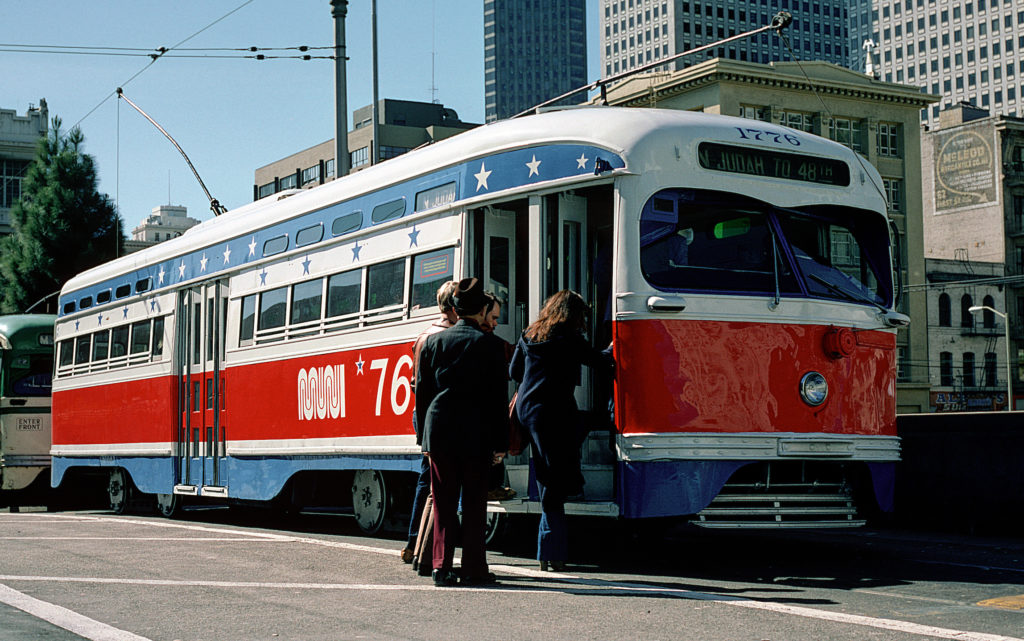 Muni PCC Streetcar 1776 with Bicentennial Livery with Passengers Boarding on Market Street | Circa March 1976