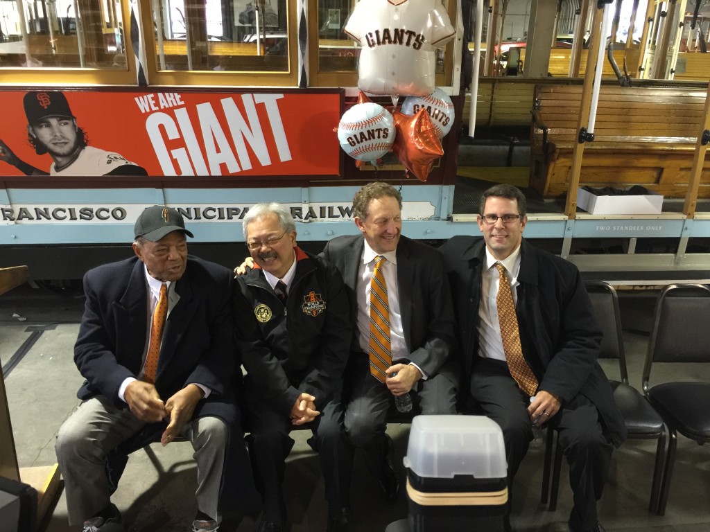 Left to right, Willie Mays, Mayor Ed Lee, Giants President and CEO Larry Baer, and SFMTA Board Member Malcolm Heinecke chat in front of Willie's cable car No. 24 before the dedication ceremony.