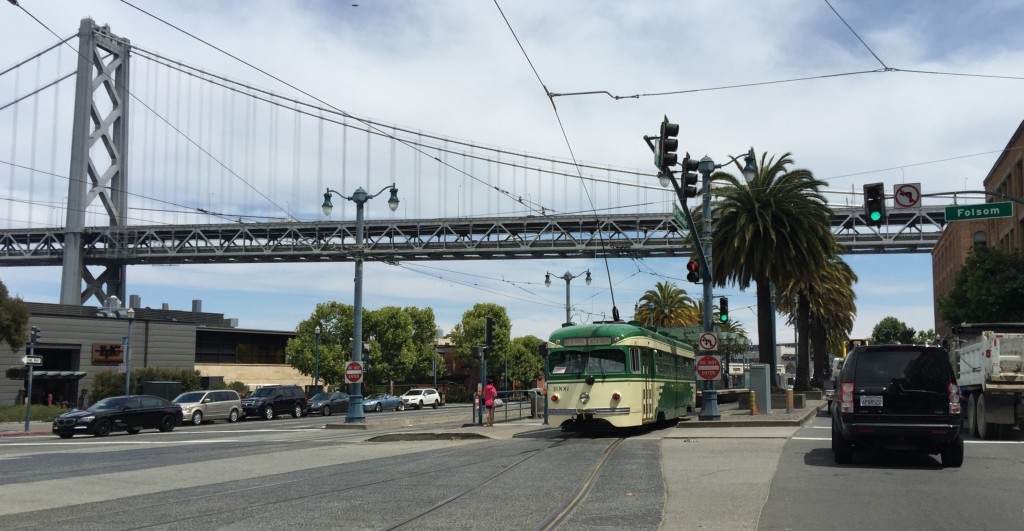 PCC Streetcar No. 1006, training on the E-line June 30, 2015, joins the light rail tracks that emerge from the Market Street Subway at Folsom Street.