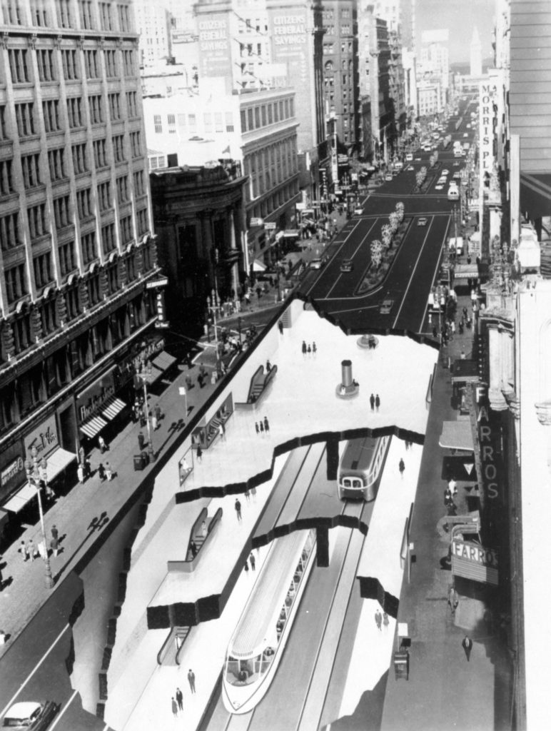 ALMOST REALITY—This late 1950s composite, made while BART was in the planning stages, showed a station under Market and O’Farrell Streets, which didn’t happen. A faithful PCC streetcar is on the Muni level, abov a conceptually-designed BART train. No overhead wires on Market, and trees in the middle! This concept culminated decades of subway dreams. SFMTA Archive